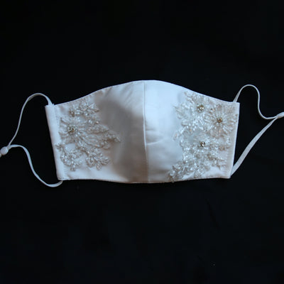 Hand embroidered re-usable, bridal face mask. Made from four layers of silk Mikado front view