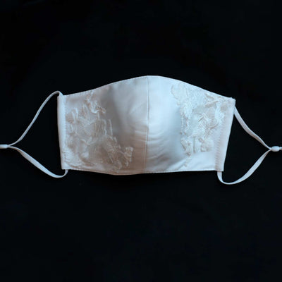Hand embroidered re-usable, bridal face mask. Made from four layers of silk Mikado front detail