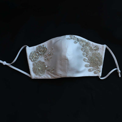 Hand embroidered re-usable, bridal facemask. 4 layers of silk Mikado material with silver sequence, glass beading
