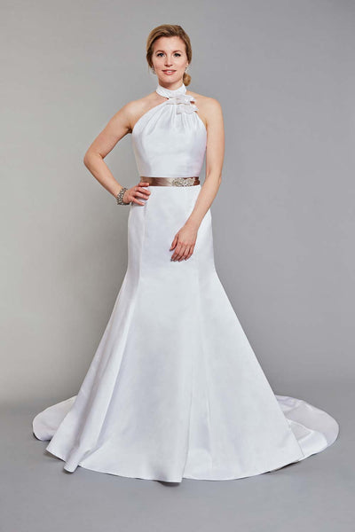 Bride wearing soft pleated halter neckline with floral detail and fitted trumpet skirt wedding dress