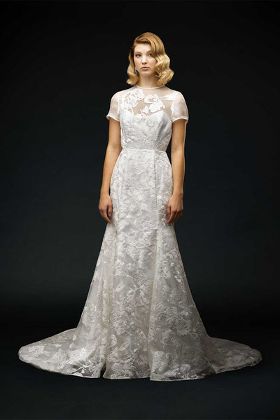 Bride wearing lace wedding dress with sleeves