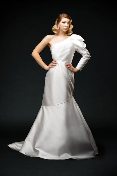 Silk mikado, asymmetrical one-sleeve wedding dress with shoulder detail and soft puddle train front view